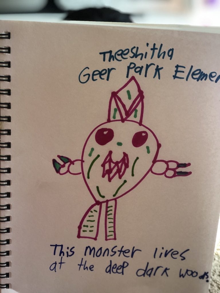 A drawing of a purple monster with green lie details, it says "This monster lives at the deep dark woods."