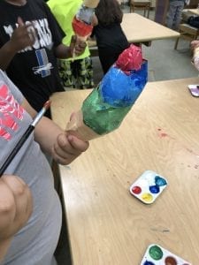 students painting their ice cream cones