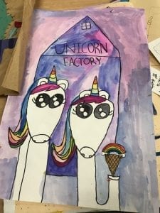 student paintig of two unicorns in front of a building titled "Unicorn Factory", one unicord is holding an ice cream cone with a rainbow where the scoop of ice cream would go
