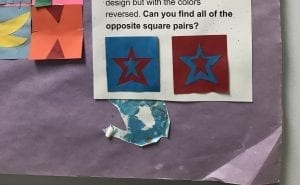 An example of two squares; one is red with a blue star and the other is blue with a red star