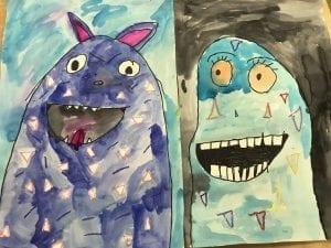 two student examples of artwork that show monsters; one looks evil and one looks happy