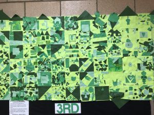 Third grade paper quilt squares using green construction paper