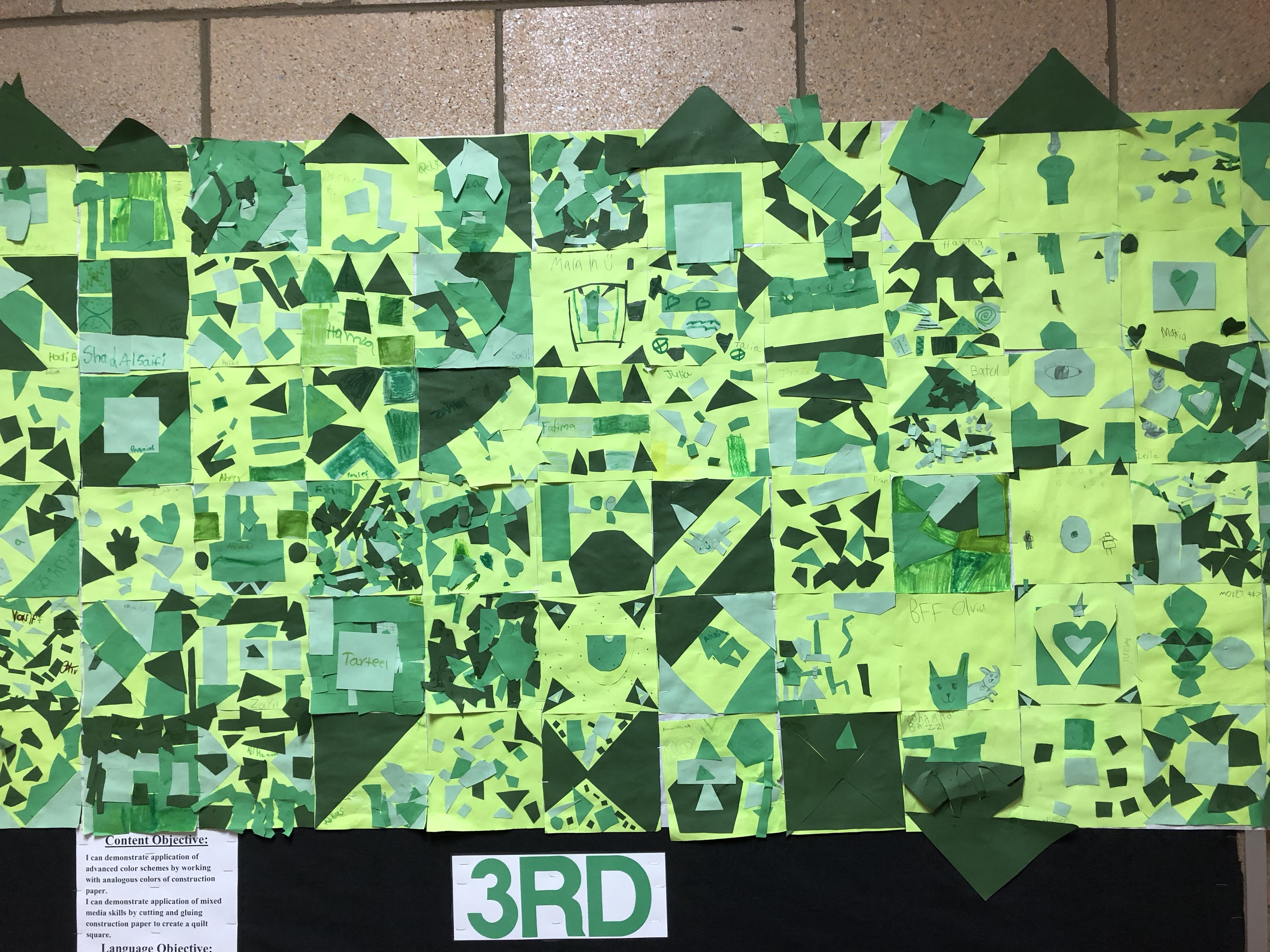 Third grade paper quilt squares using green construction paper