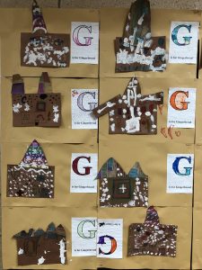 paper gingerbread houses with white paint details made by Kindergarten students