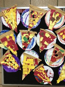 paper pizza slices made by 1st grade students