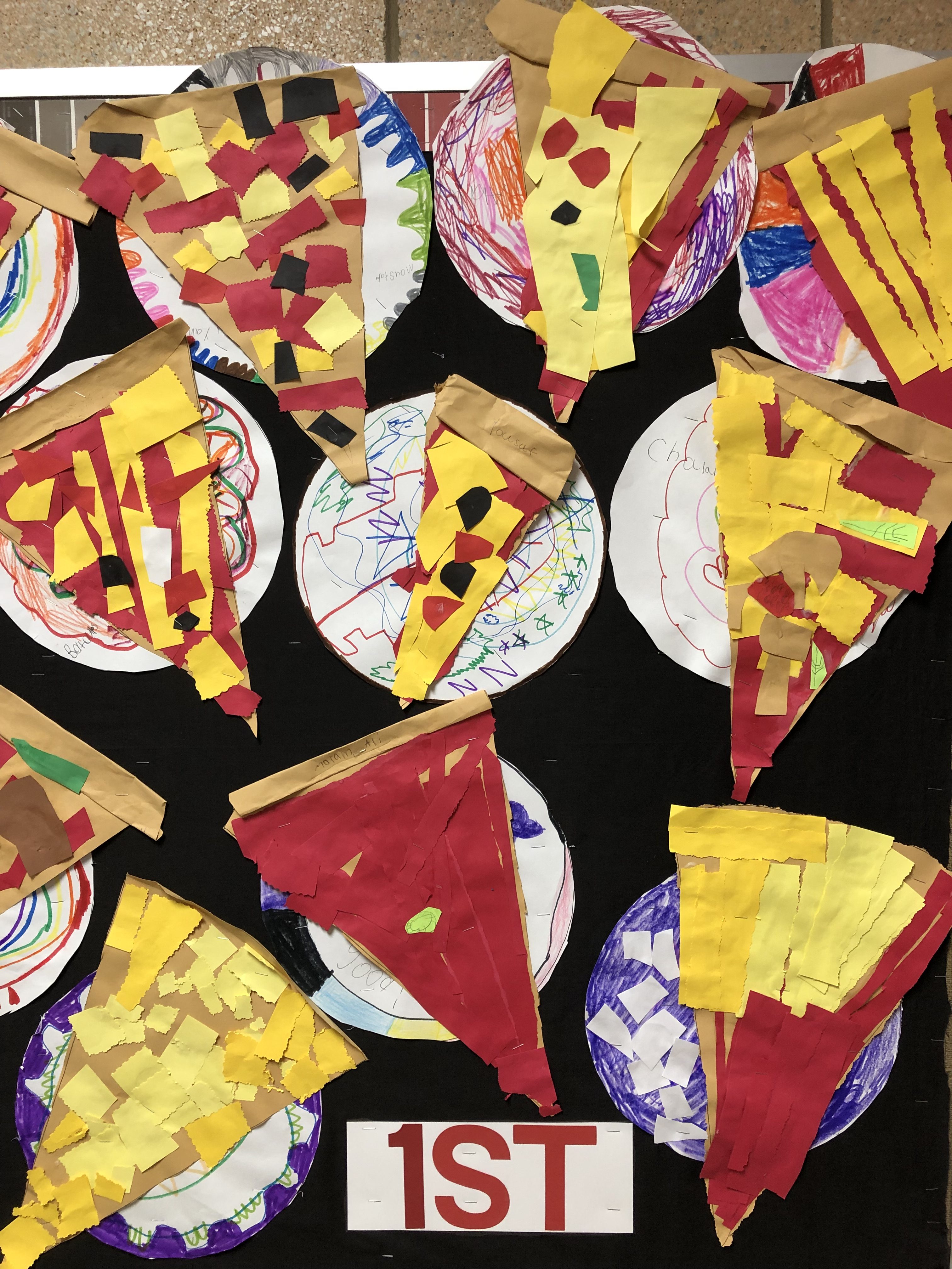 paper pizza slices made by 1st grade students