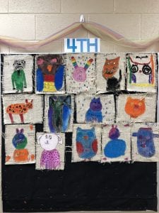 Animal drawings on burlap. Fourth grade students practiced sewing a running stitch in the burlap.