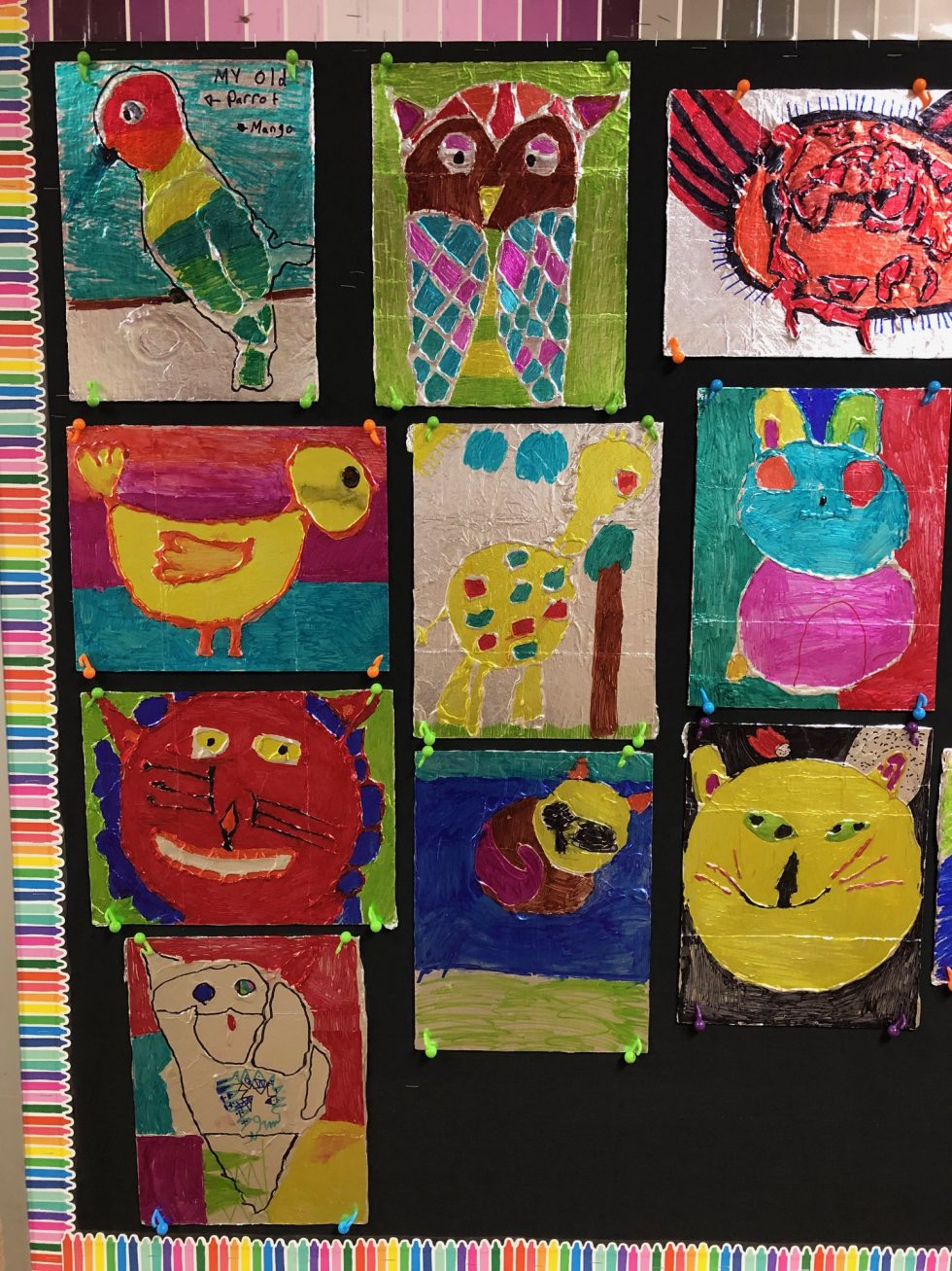 foil animal drawings by fourth grade students colored with Sharpie markers