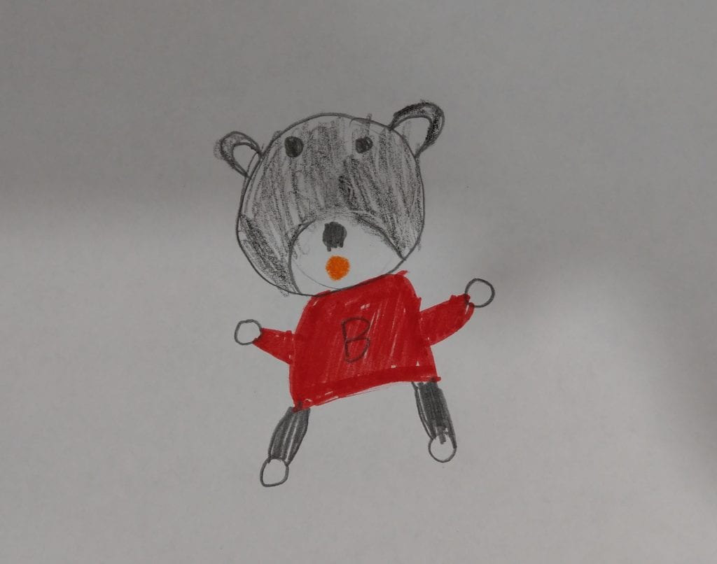 drawing of a teddy bear wearing a red shirt