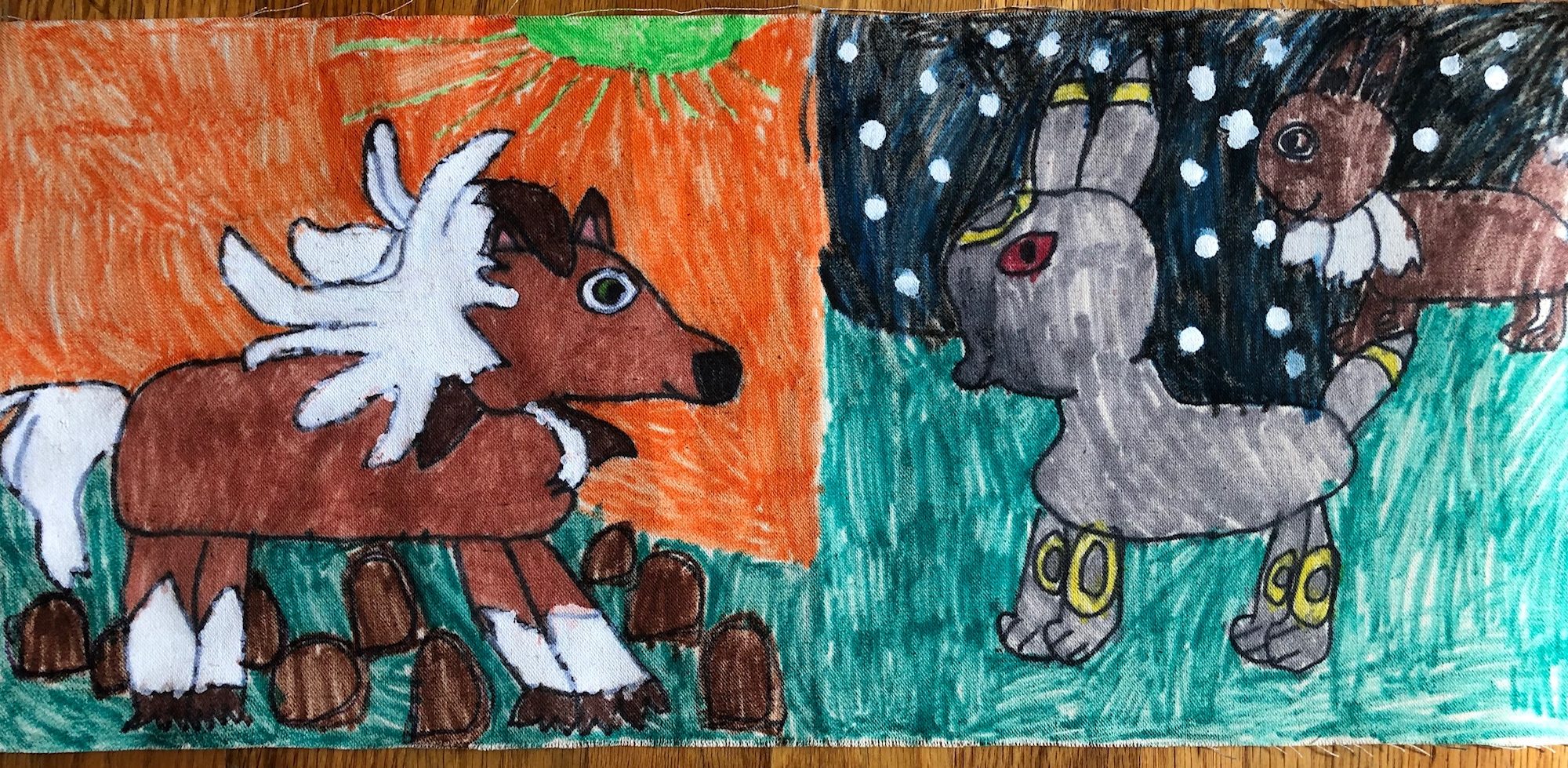 drawing of three pokemon characters on fabric colored with markers and white paint pen