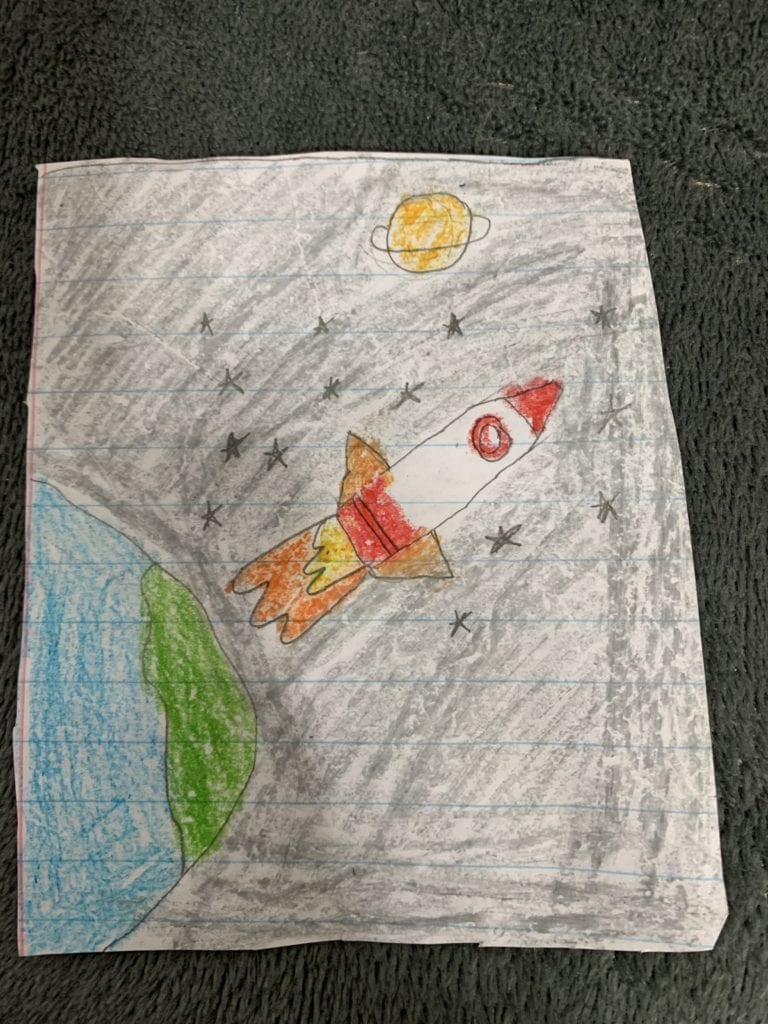 drawing of a rocket flying in space away from the earth