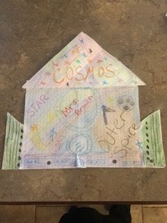 origami folded background with words and colored with rainbow colors