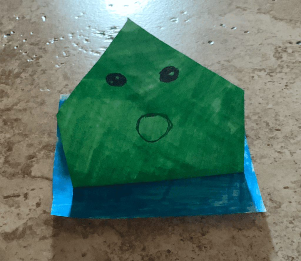 origami jumping frog colored green
