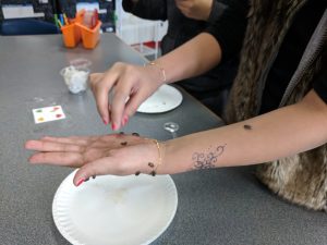 Student holding isopods