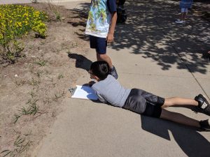 Student observing signs of spring