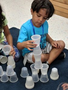 Students stacking cups