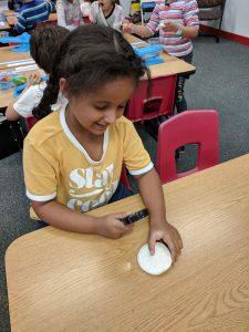 using magnifying glasses