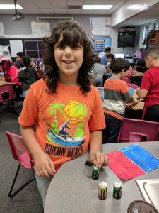 Student creating sound.