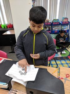 Student testing his bridge.
