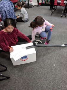 Students testing roller coasters.