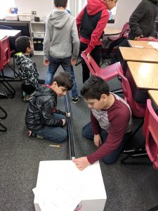 Students testing roller coasters