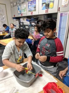 Students testing their water wheel.