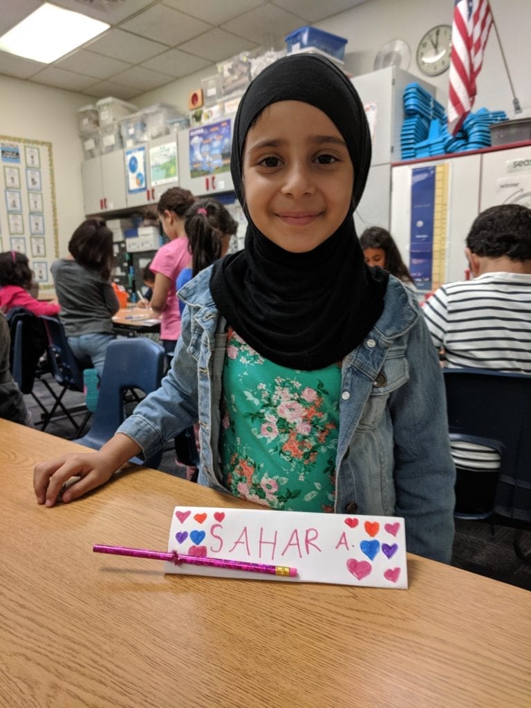 Student with name tag she created.