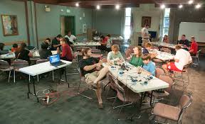 a makerspace with students at tables