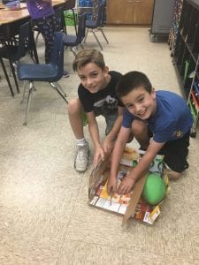 2 students work on their STEAM project