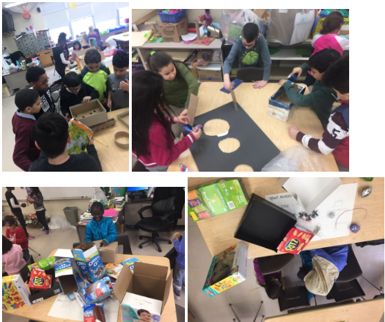 students work on their cardboard arcades in the art room