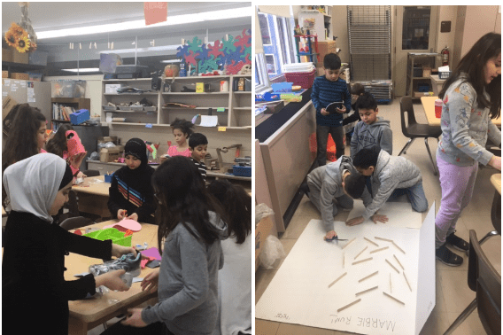 students work on their cardboard arcade games in the art room