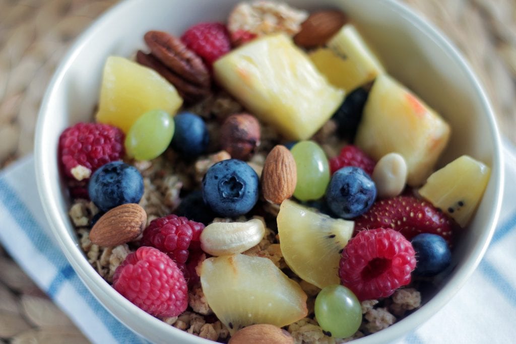 Mixed nuts and fruits in a cup.