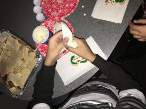 Students decorating their cookies