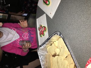 Students decorating their cookies