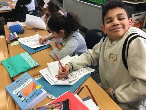 Student coloring his project after finishing his problems