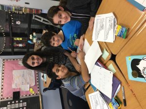 Students helping one another on math project