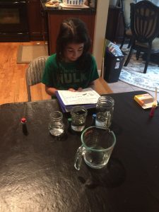 Sienna demonstrates excellent scientific processes as she follows the procedures carefully for the experiment!