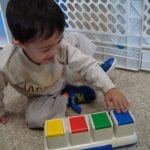Student playing with toy