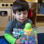 Student playing with toy