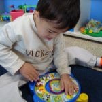 Student playing with toy