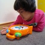student playing with a toy