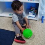 student rolling a ball