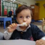 Student eating pudding