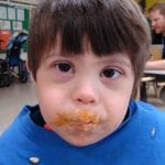 Student eating pudding
