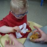 Student eating pudding