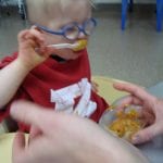 Student eating pudding