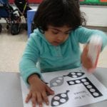 student using bingo marker