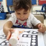 student using bingo marker