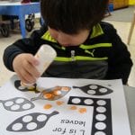 student using bingo marker