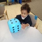 student with dice
